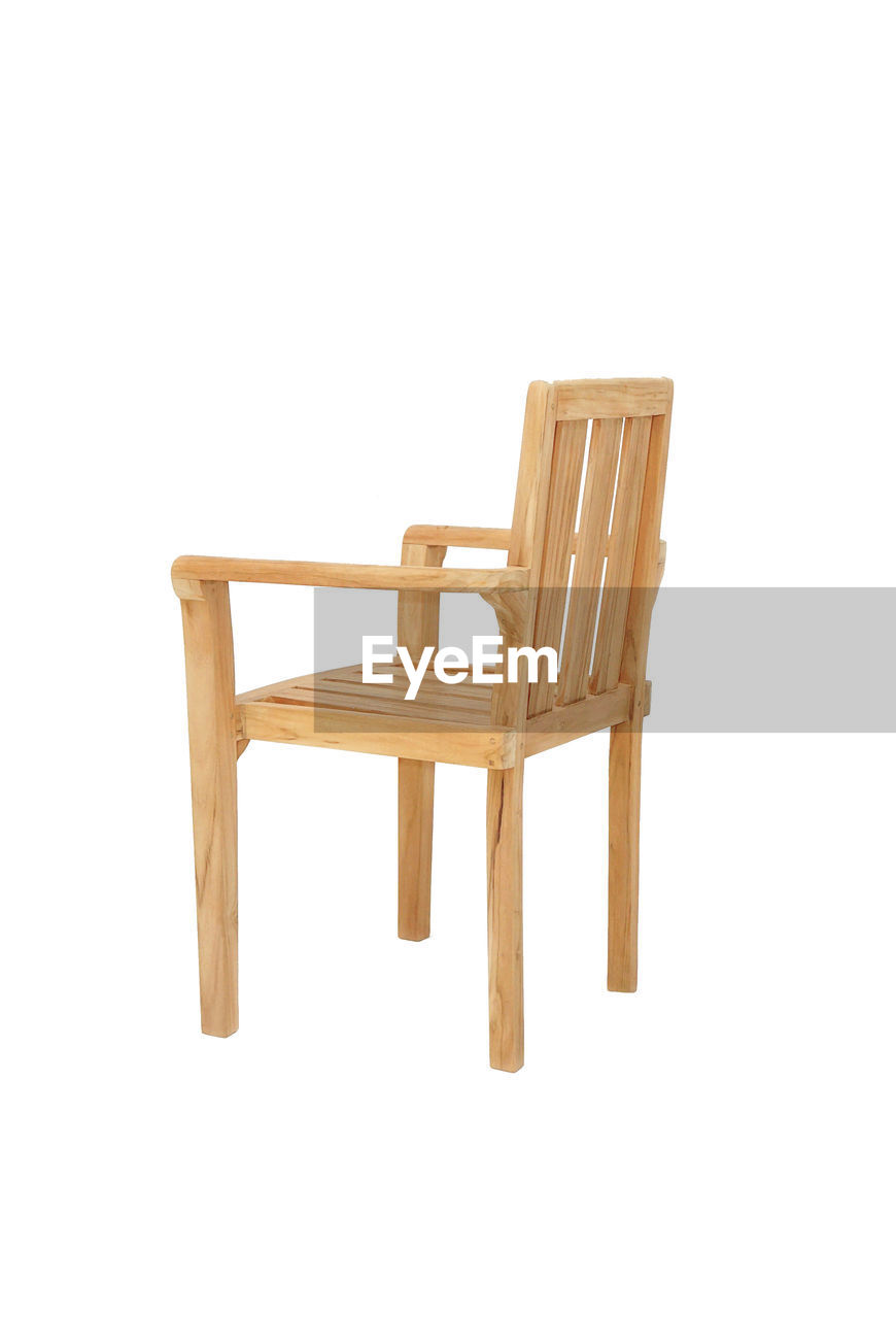 VIEW OF EMPTY CHAIR AGAINST WHITE BACKGROUND