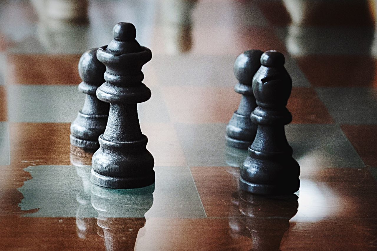 Close-up of chess pieces on board