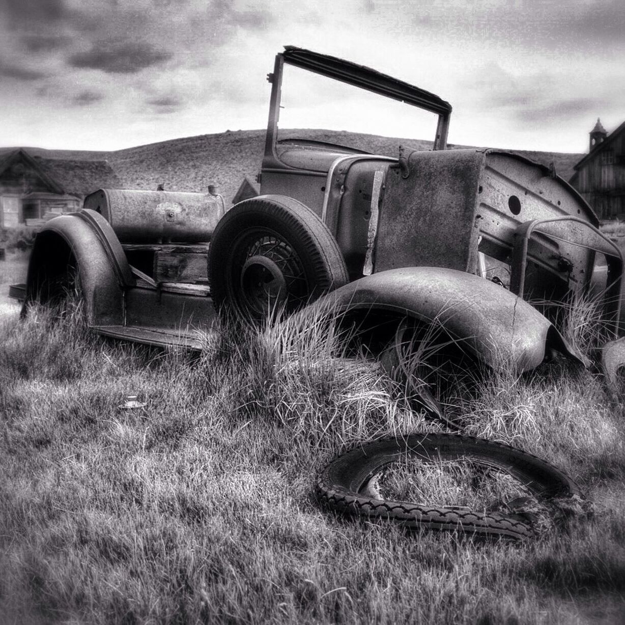 Abandoned car in field