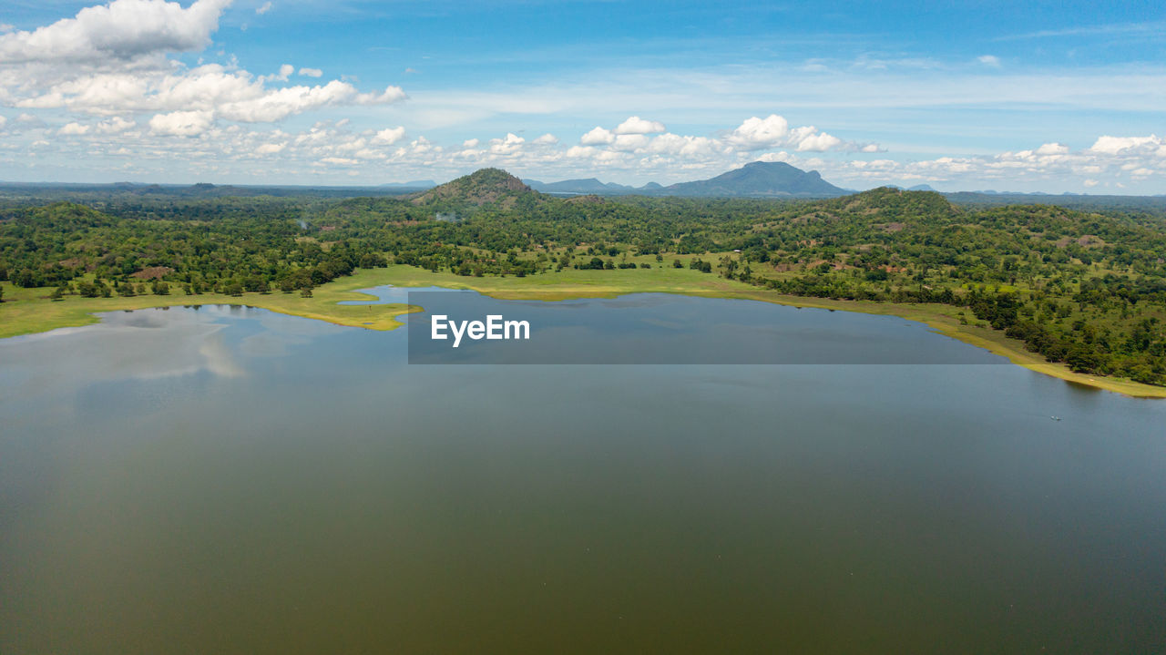  tropical landscape with lake and valley with tropical forest. sorabora lake, sri lanka.