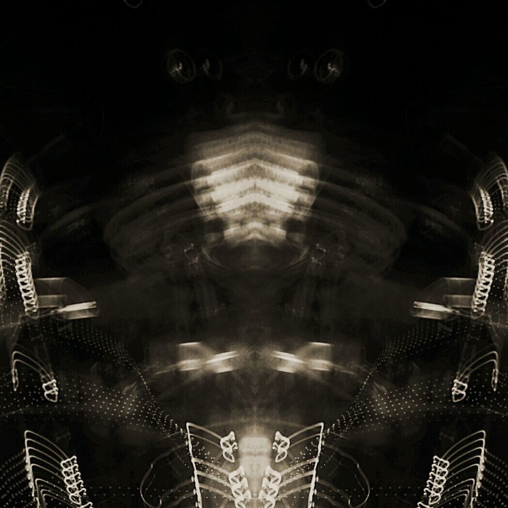 illuminated, no people, symmetry, indoors, black background, close-up, day
