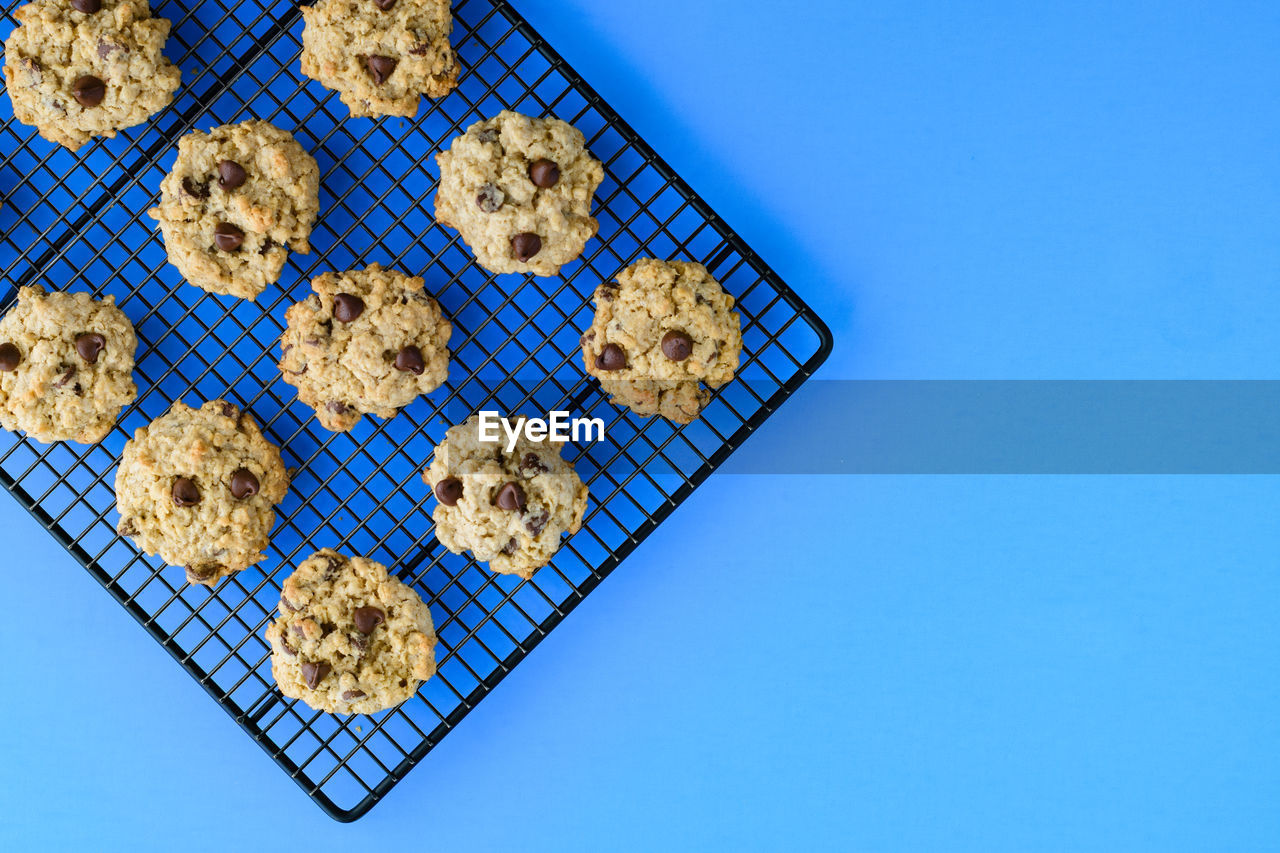 HIGH ANGLE VIEW OF COOKIES AGAINST BLUE SKY