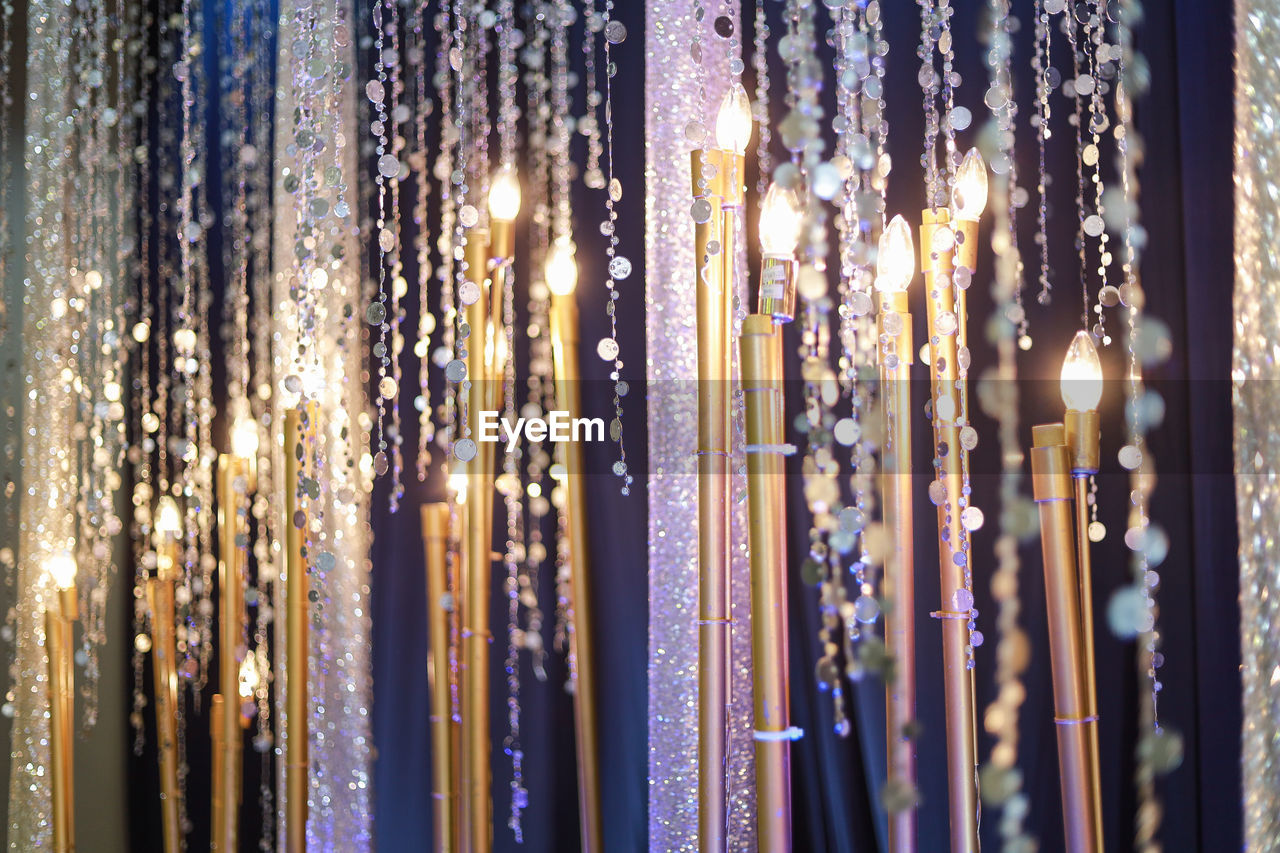 Illuminated decorations hanging at night