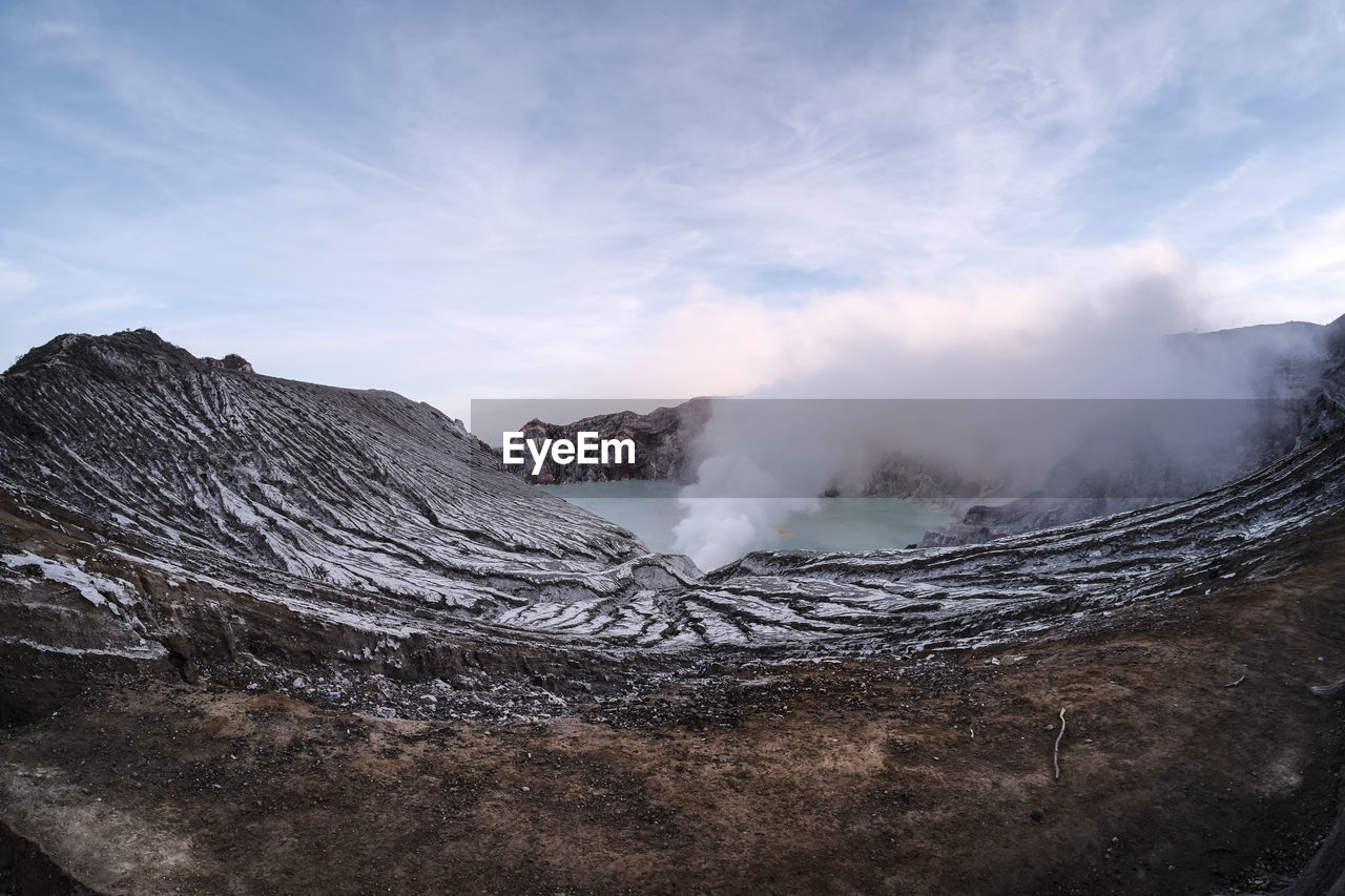 View of volcanic landscape against sky