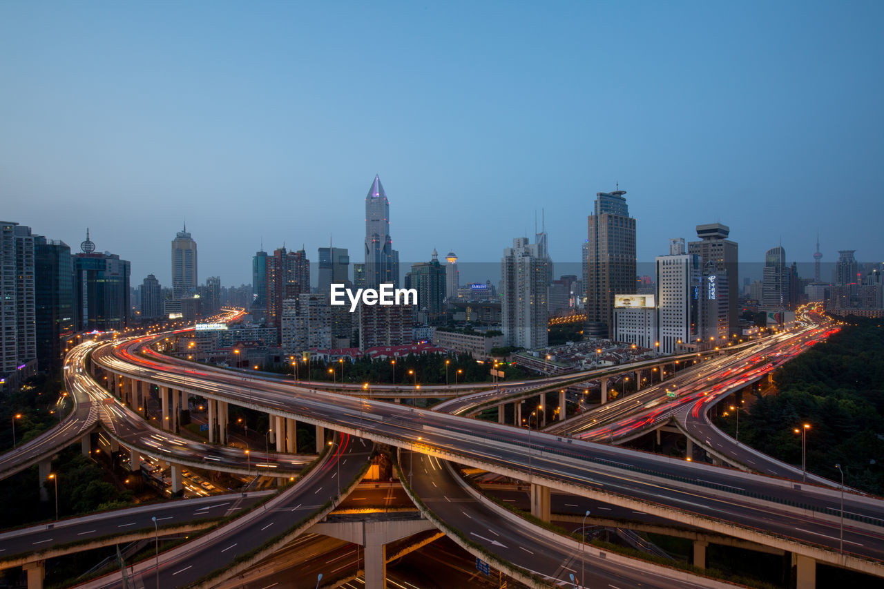 High angle view of light trails on road in city