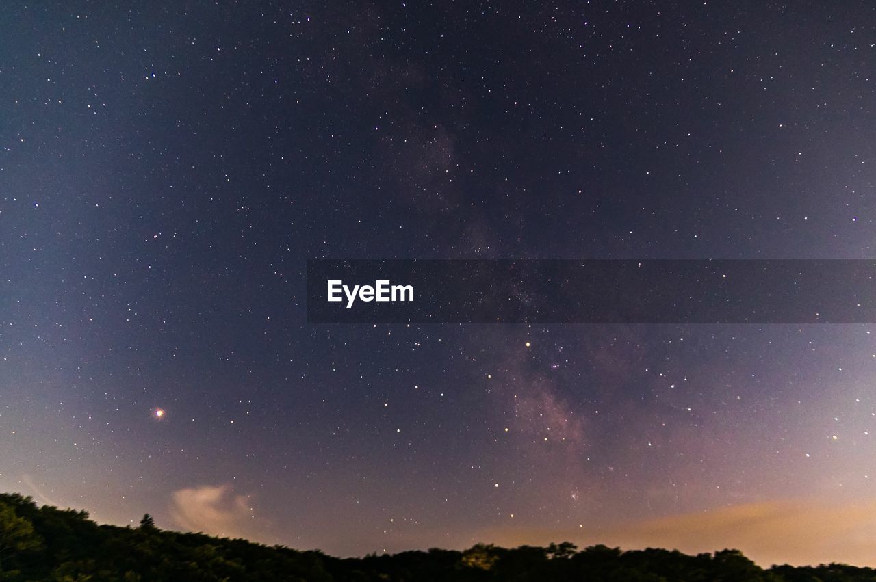 LOW ANGLE VIEW OF STARS AGAINST SKY AT NIGHT