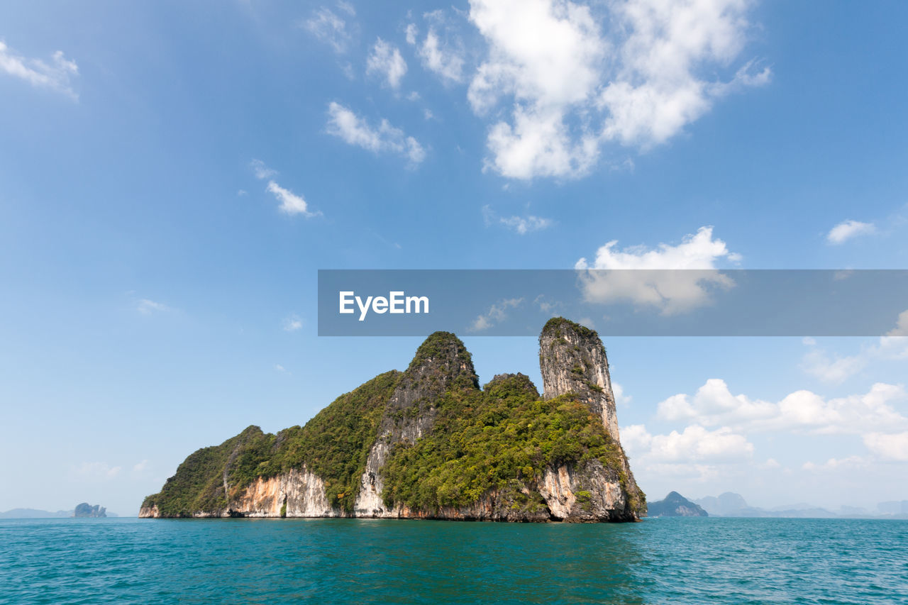 Scenic view of sea and rocks against sky