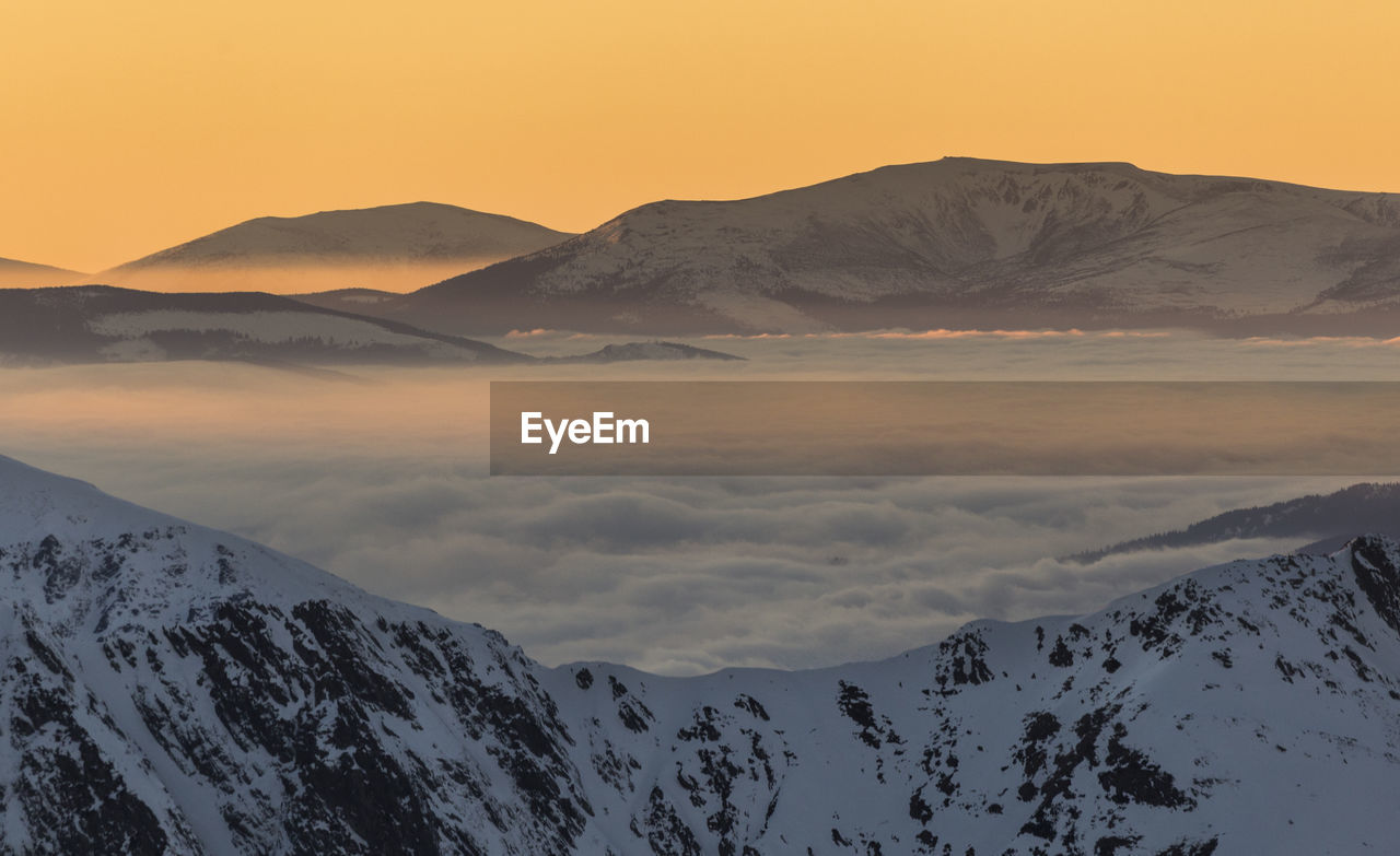 Scenic view of snowcapped mountains against sky during sunset, fagaras mountains
