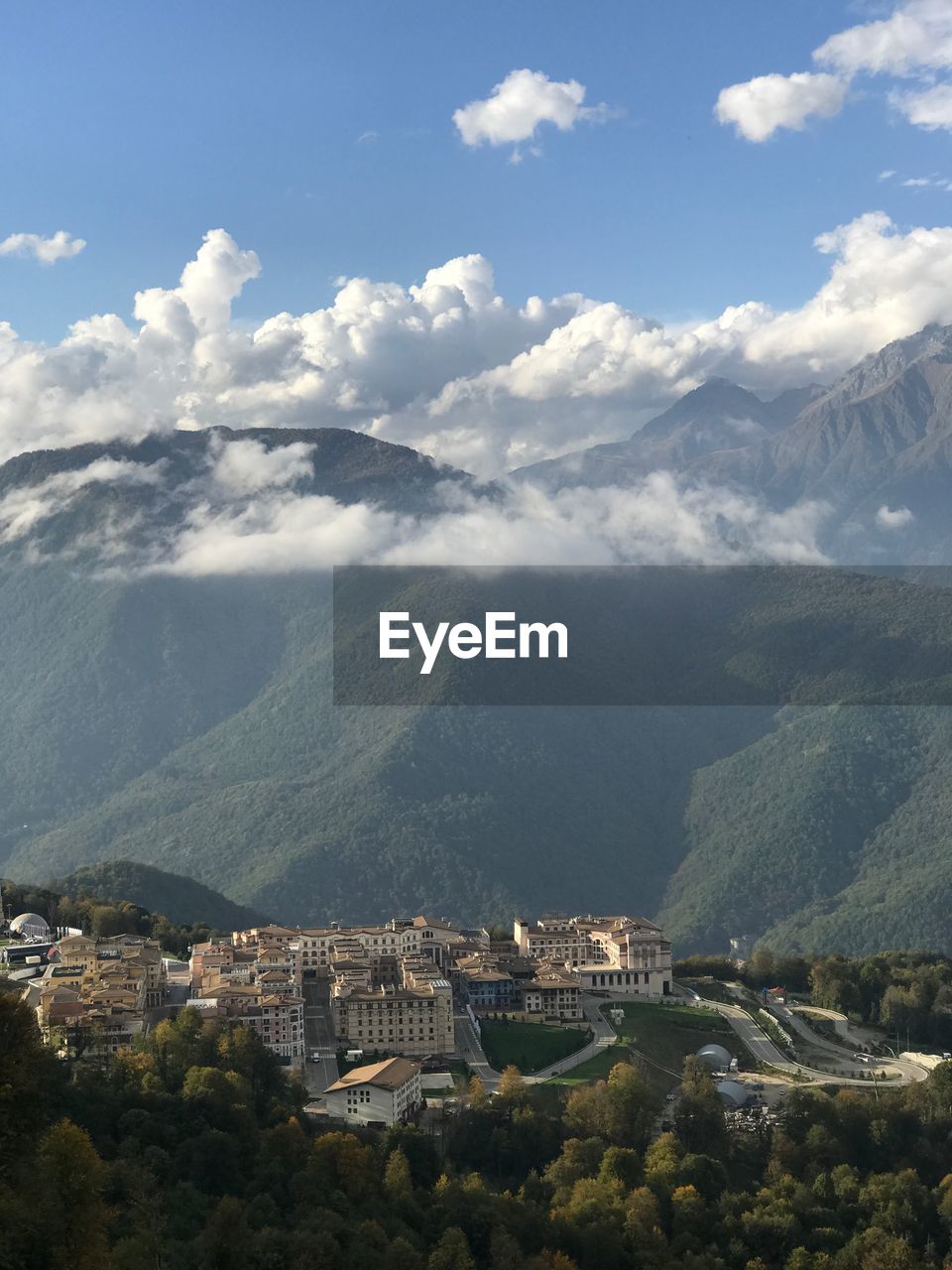 High angle view of buildings and mountains against sky