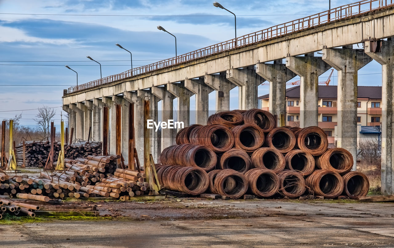 architecture, transport, sky, urban area, built structure, transportation, industry, nature, business finance and industry, cloud, no people, day, city, outdoors, road, bridge, architectural column, street, building exterior, track