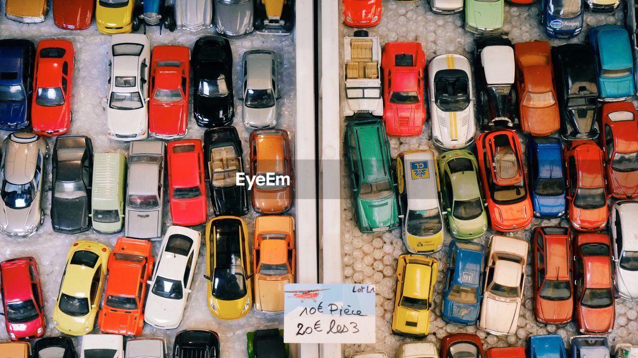 Full frame shot of colorful toy cars with label at store