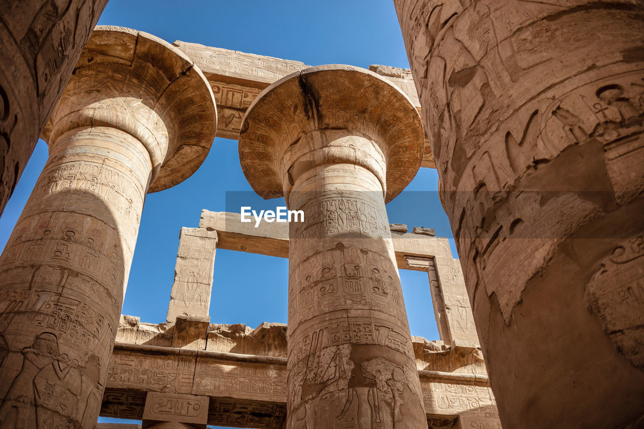 Different columns with hieroglyphs in karnak temple. karnak temple is the largest complex in egypt.