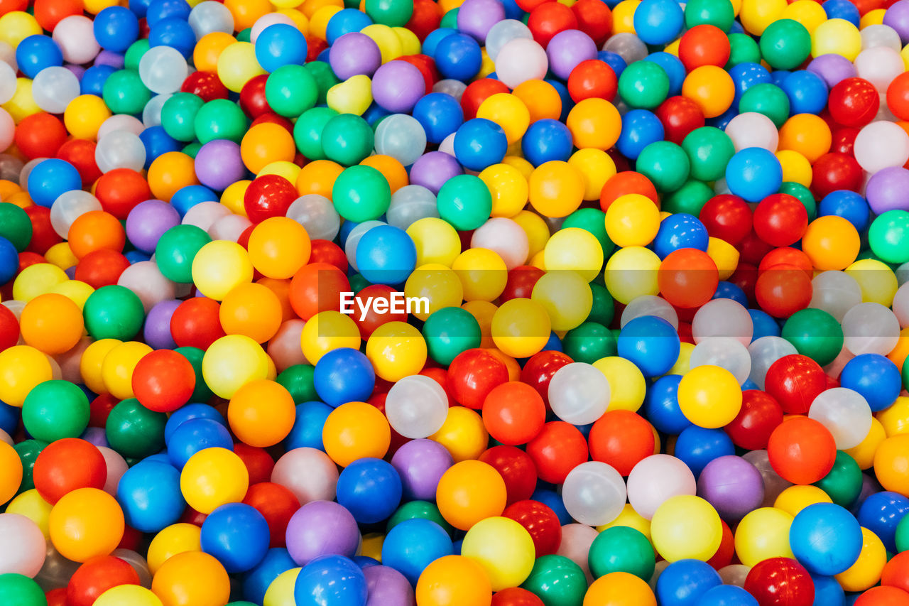 HIGH ANGLE VIEW OF MULTI COLORED BALLS IN THE POOL
