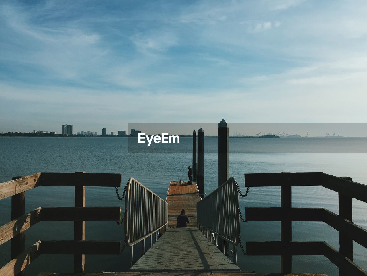 Pier over sea against sky