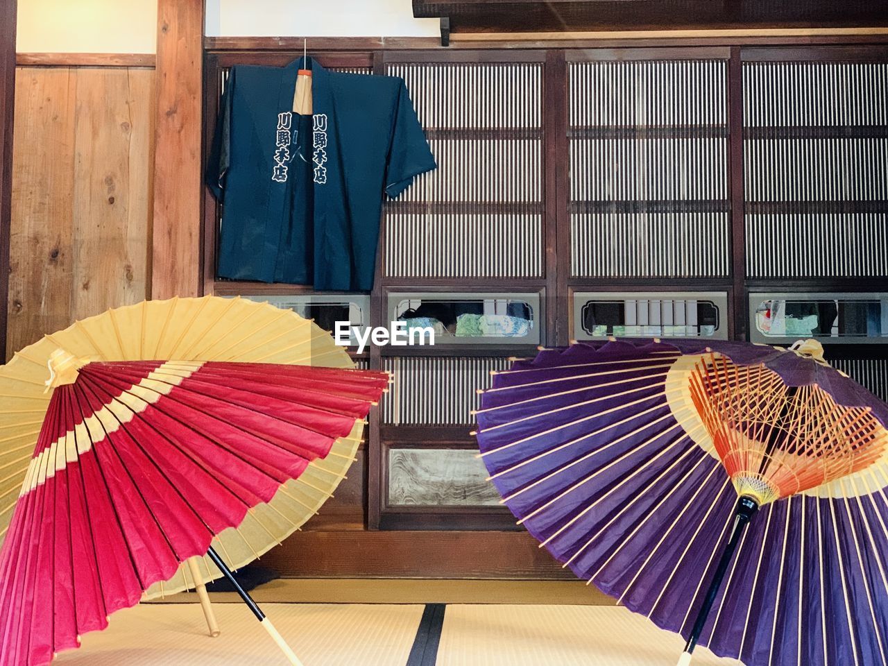 umbrella, fashion accessory, parasol, no people, protection, architecture, hand fan, culture, multi colored, security, foldable, wood, indoors, day