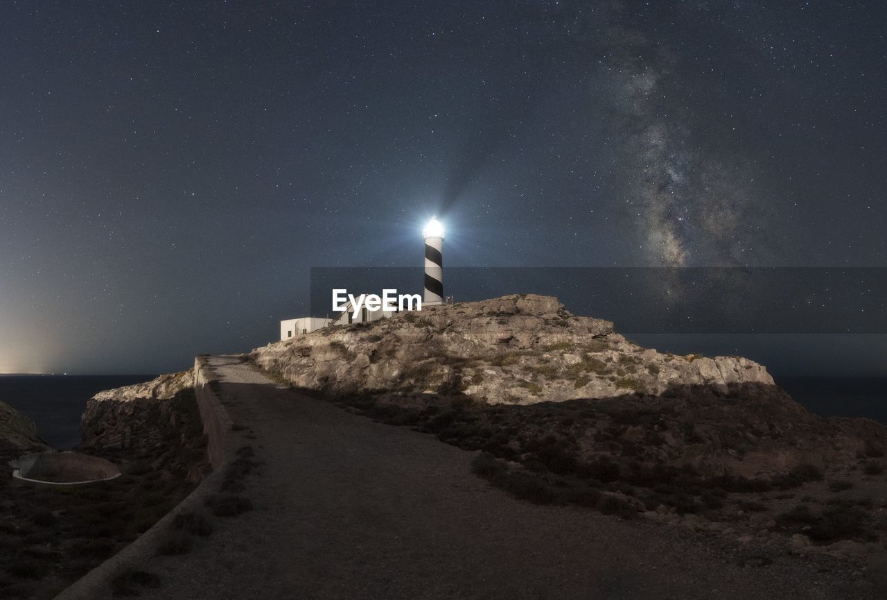 scenic view of beach against sky at night