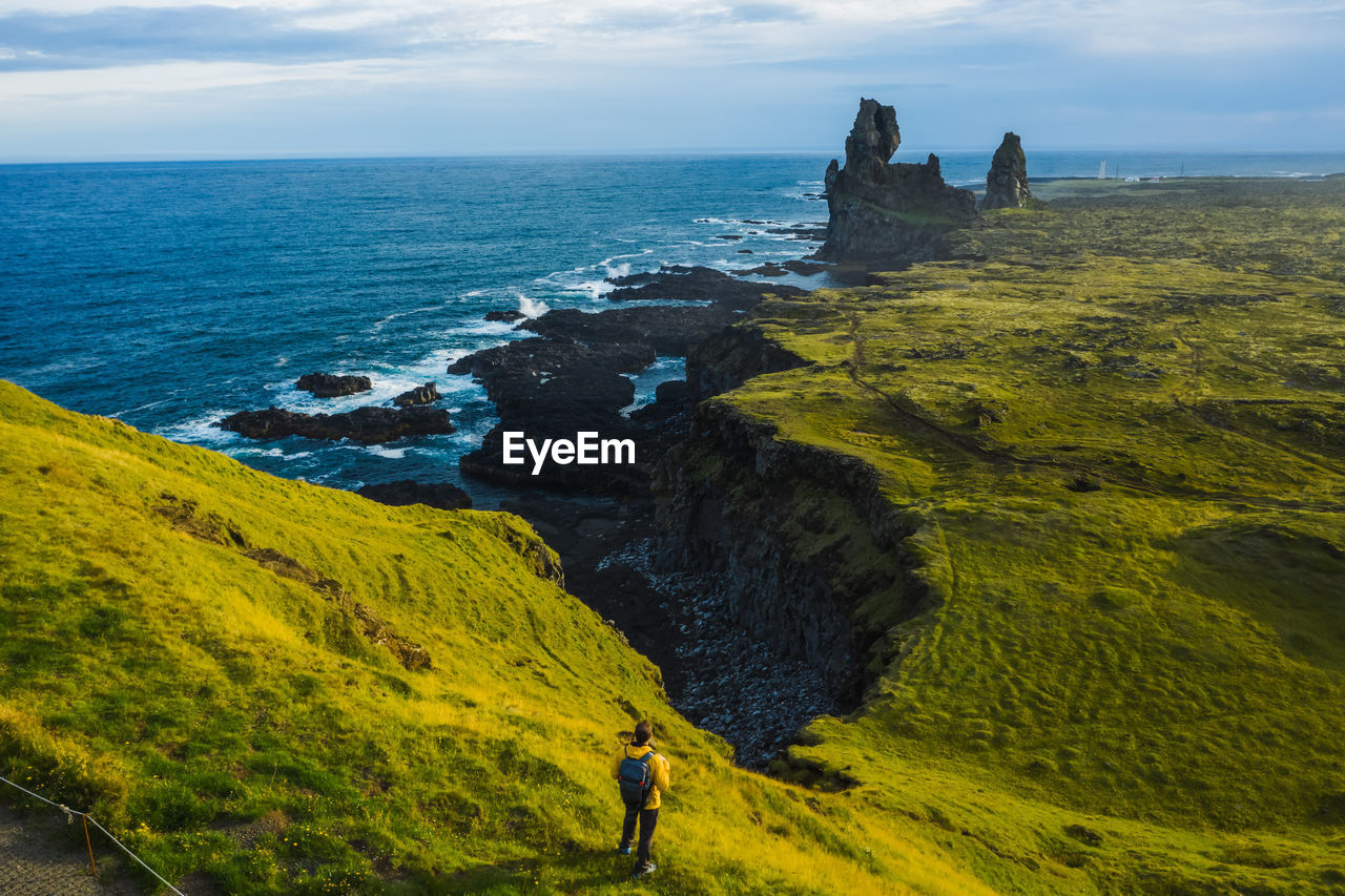 SCENIC VIEW OF SEA AND ROCKS AGAINST SKY