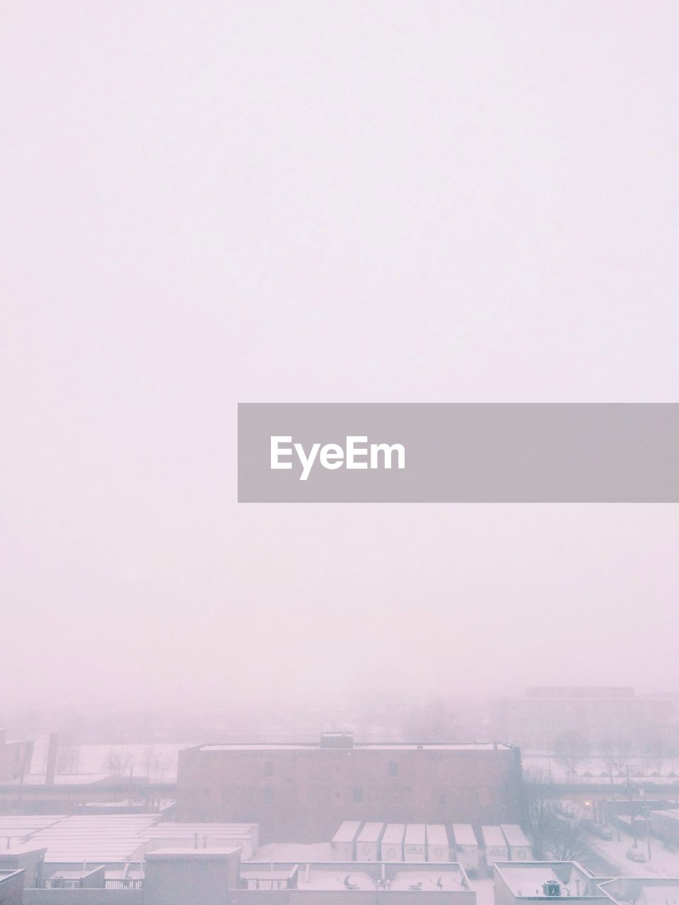 High angle view of buildings during foggy weather