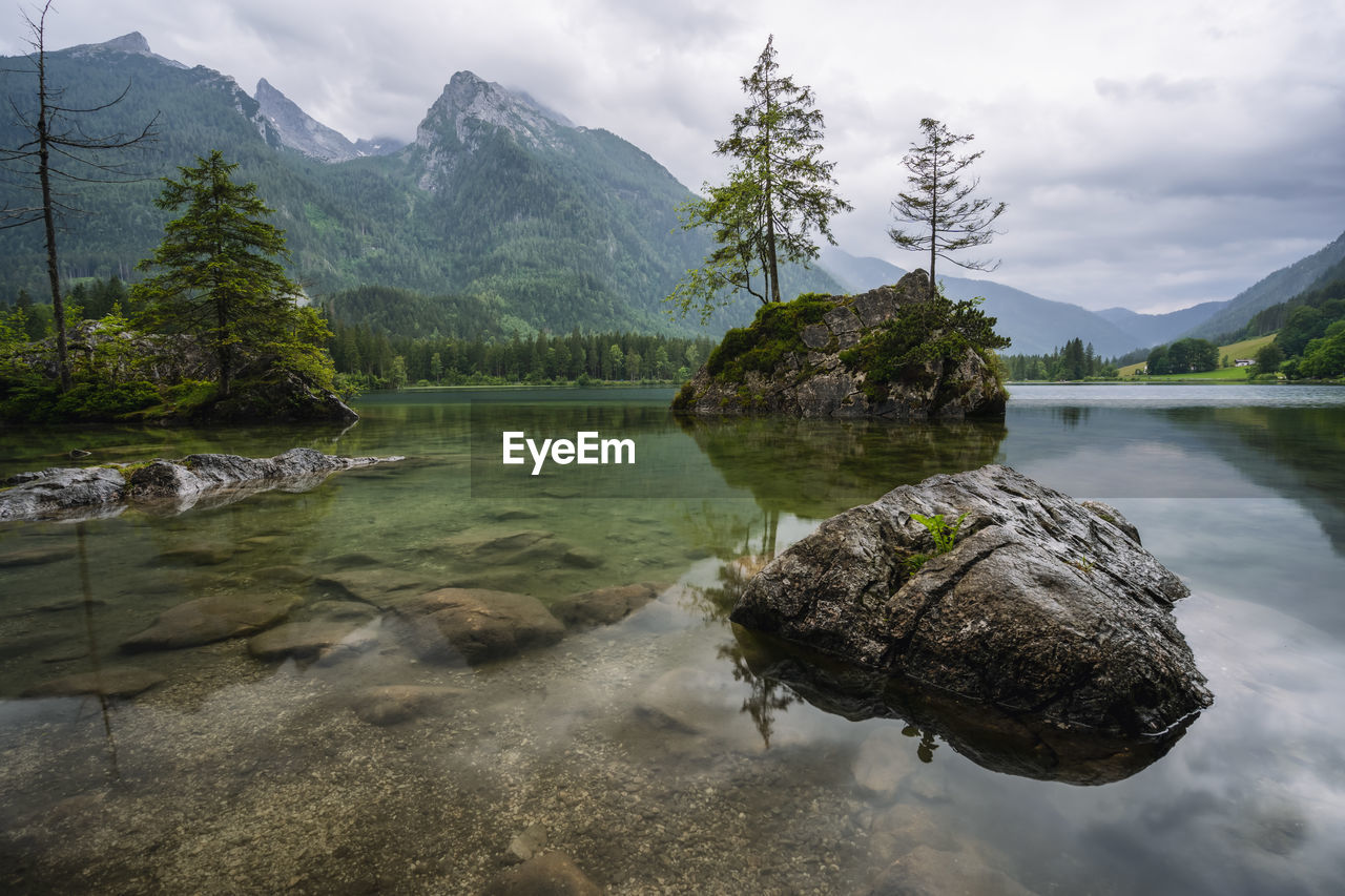 SCENIC VIEW OF LAKE AGAINST MOUNTAIN