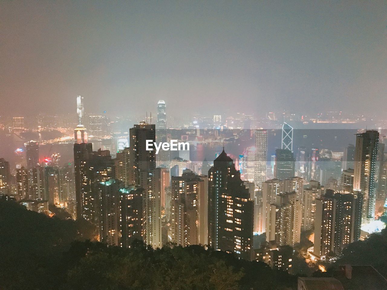 ILLUMINATED BUILDINGS AGAINST SKY AT NIGHT