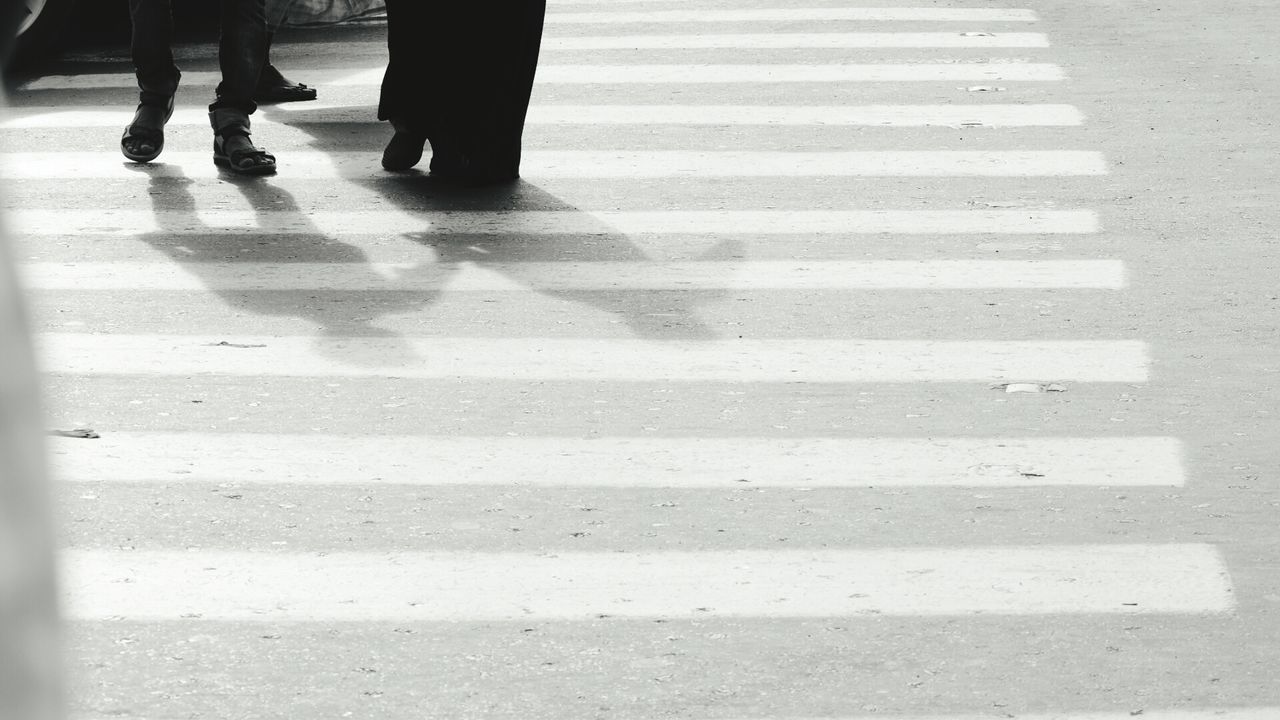 Low section of people crossing road