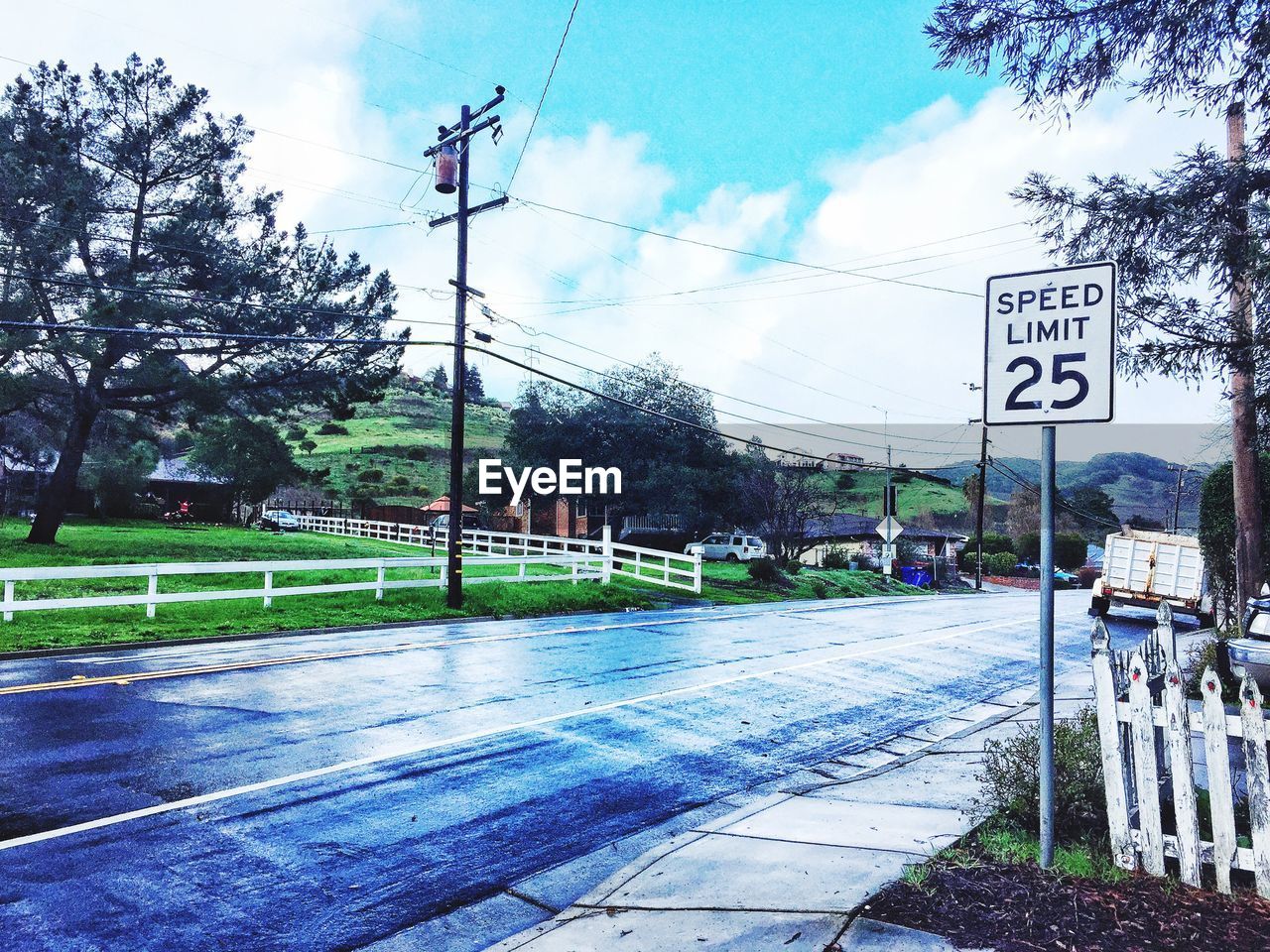 VIEW OF ROAD AGAINST CLOUDY SKY