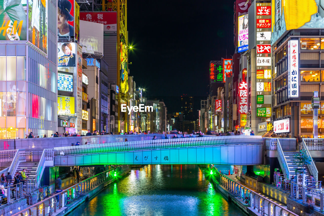 Osaka, japan tourist walking in night shopping street  dotonbori  osaka, namba, osaka, japan.