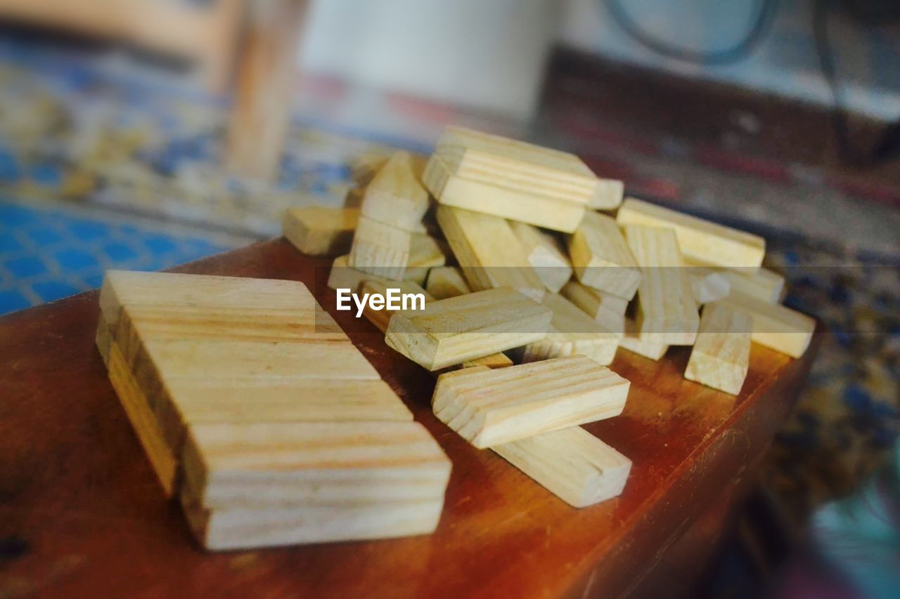 CLOSE-UP OF BREAD ON WOODEN TABLE