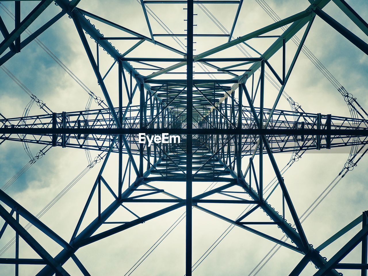 LOW ANGLE VIEW OF ELECTRICITY PYLONS AGAINST SKY