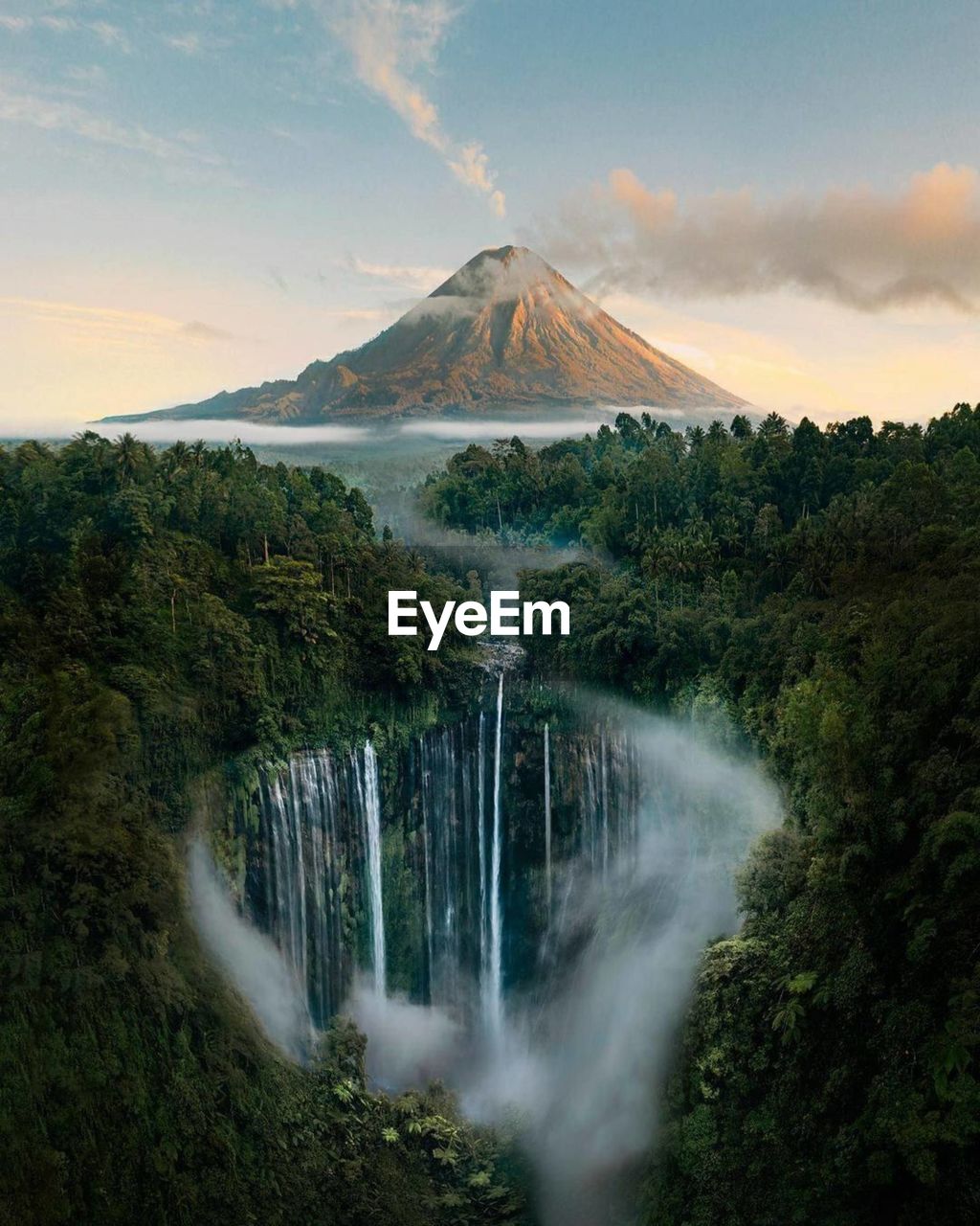 Scenic view of waterfall against sky