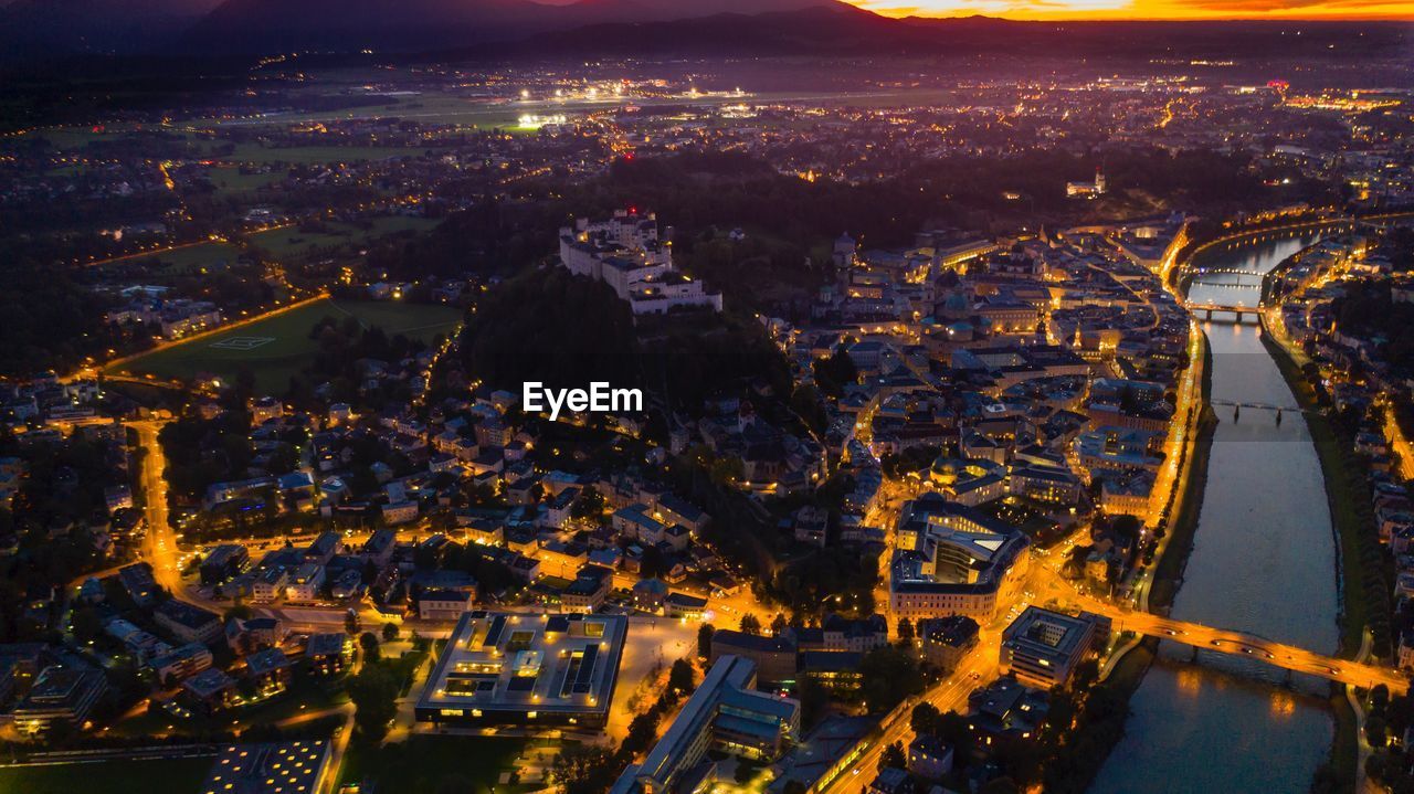 Aerial view of illuminated city at night