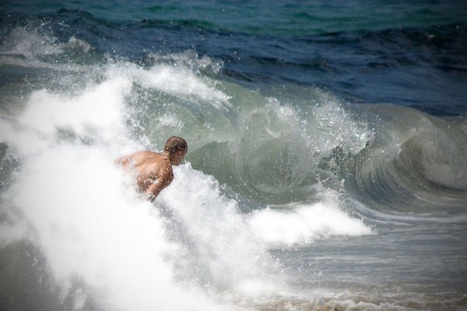 WAVES SPLASHING ON ROCKS