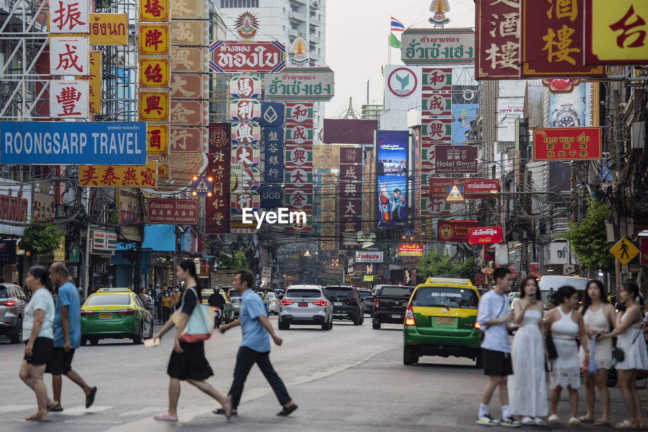 people walking on street in city