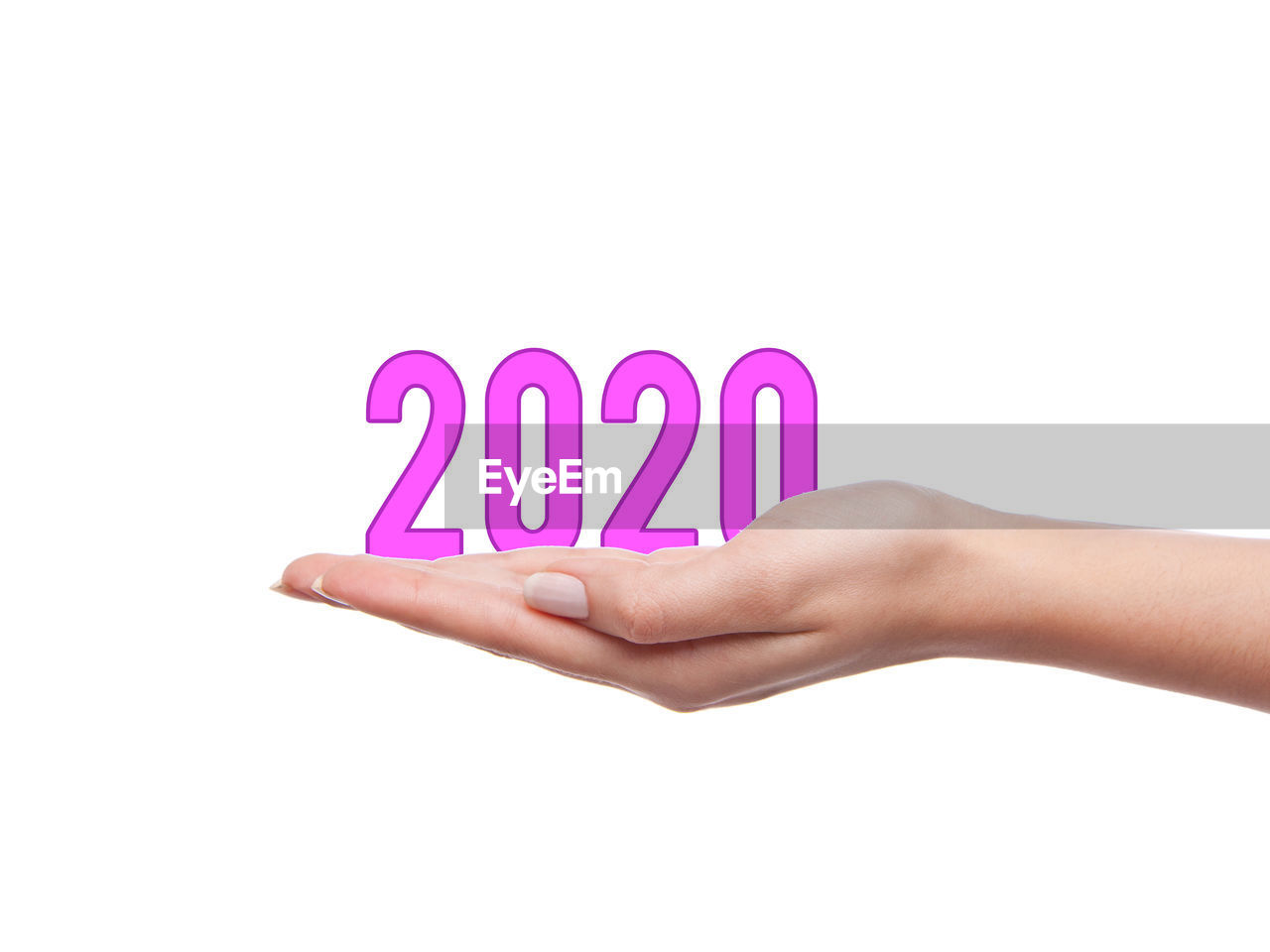 CLOSE-UP OF HAND HOLDING TEXT