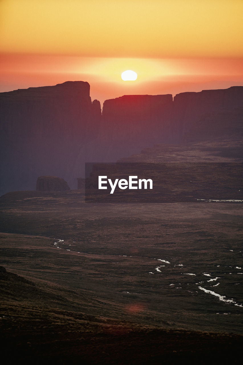 Scenic view of sea against sky during sunset in the drakensberg, south africa.