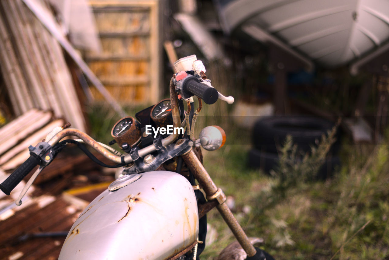 CLOSE-UP OF BICYCLE PARKED ON POLE