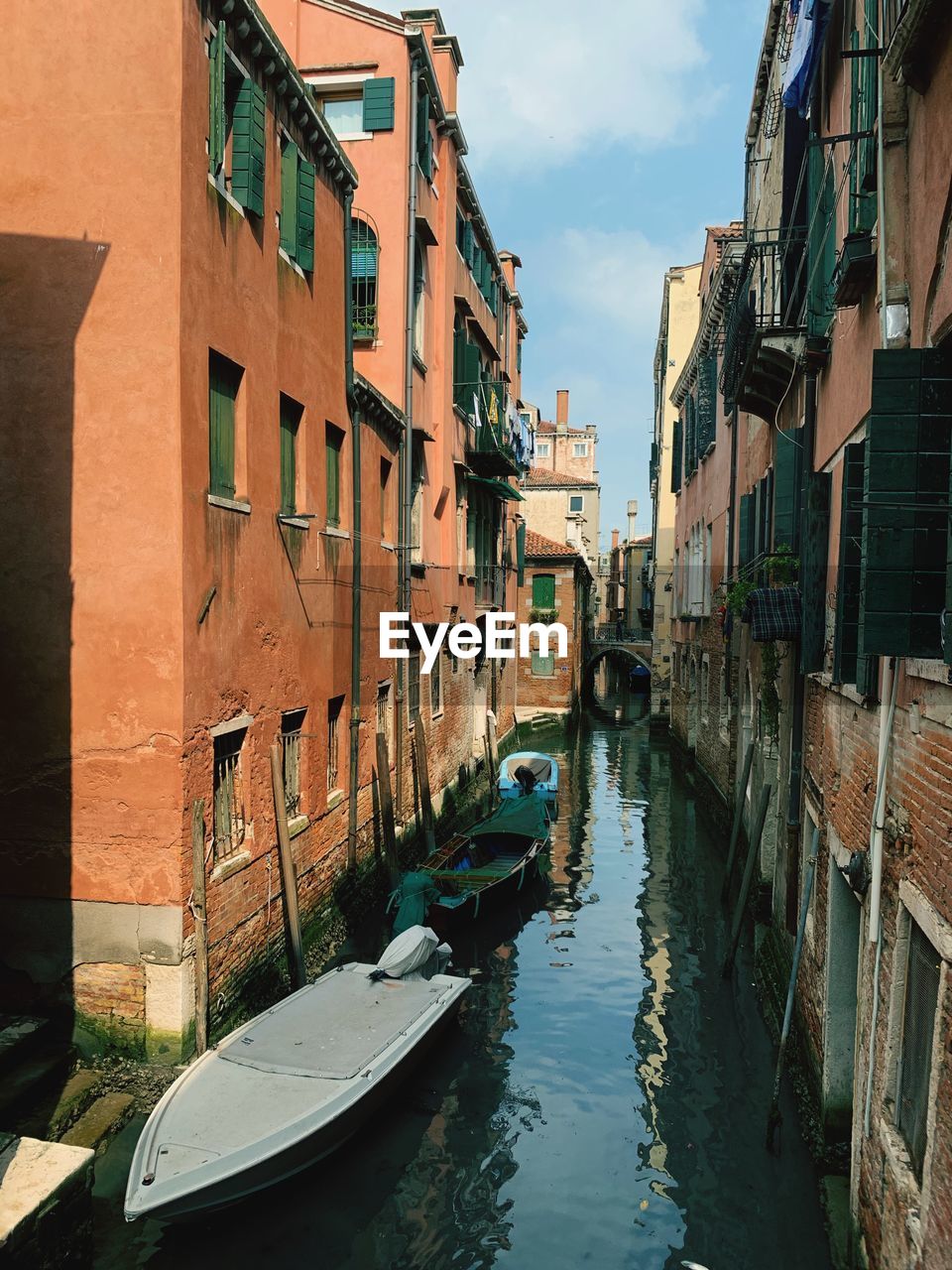 Canal amidst buildings in city