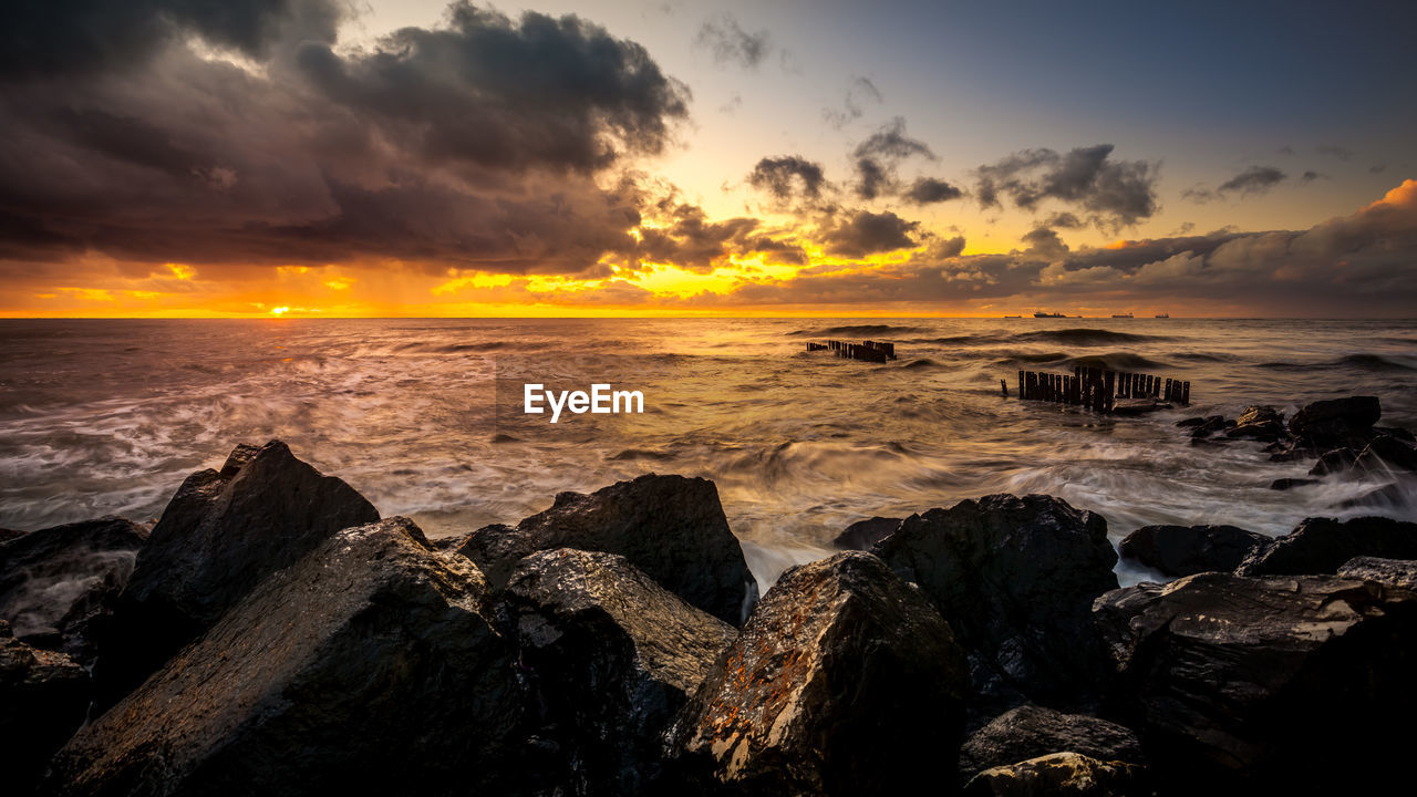 Scenic view of sea against sky during sunset