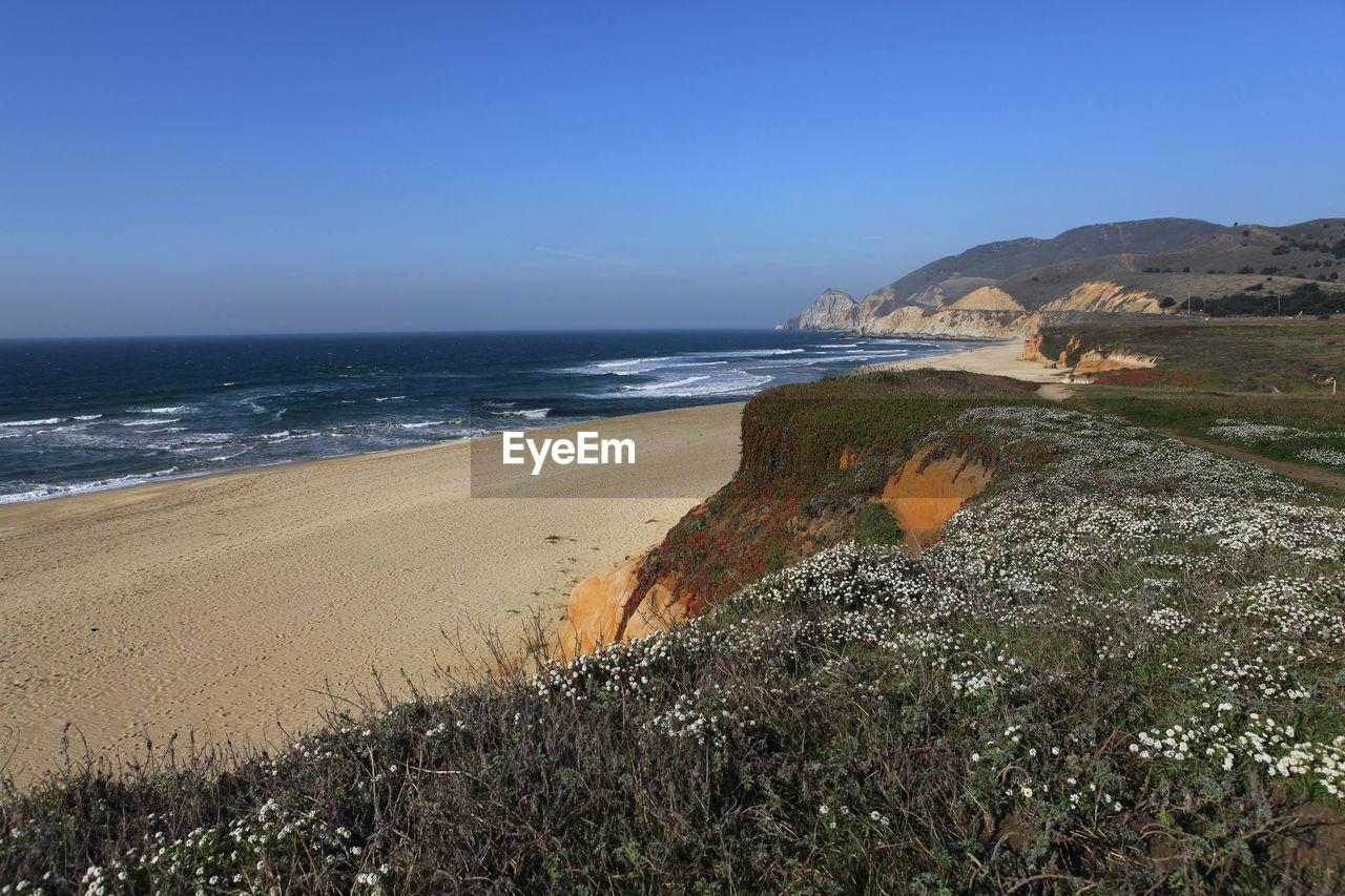 View of beach against clear sky