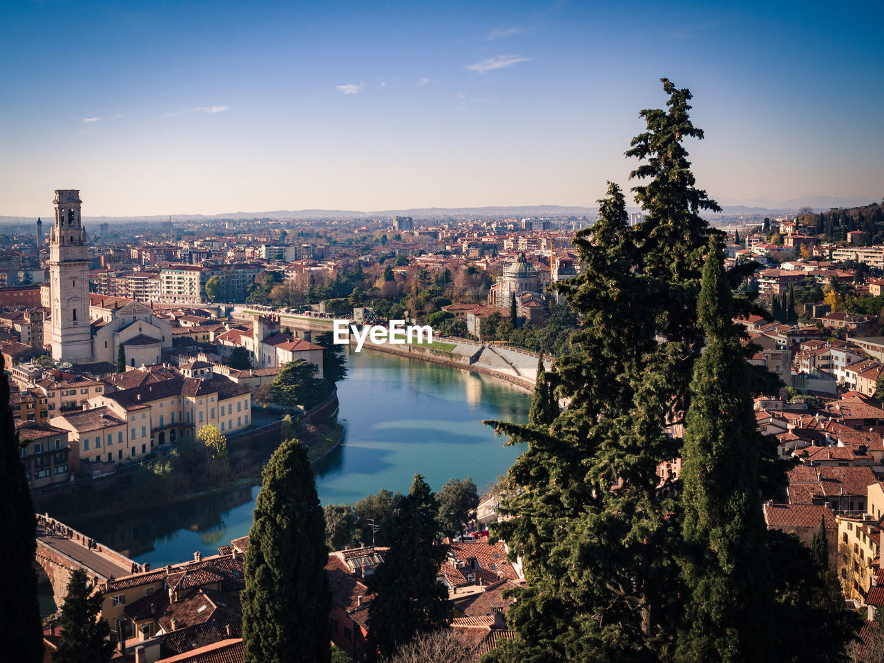 High angle view of river amidst buildings against sky