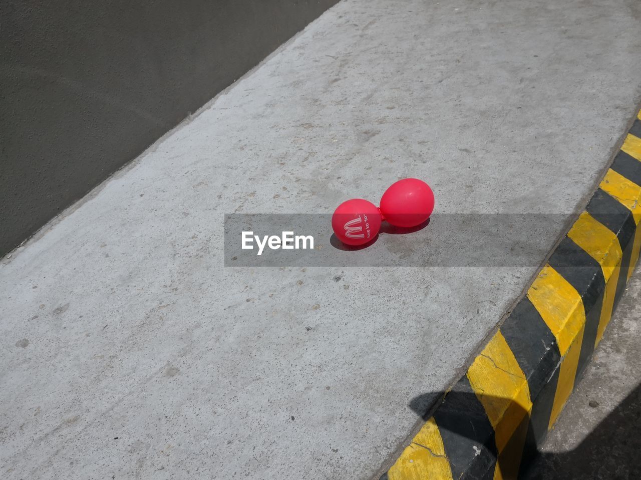 HIGH ANGLE VIEW OF RED BALLOONS