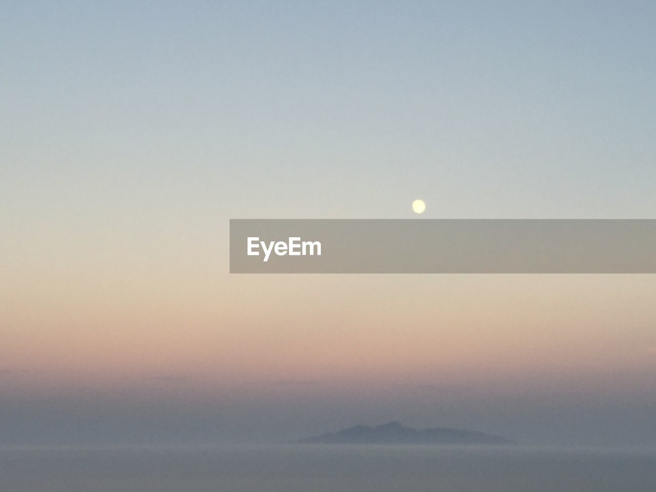 SCENIC VIEW OF MOON AGAINST CLEAR SKY