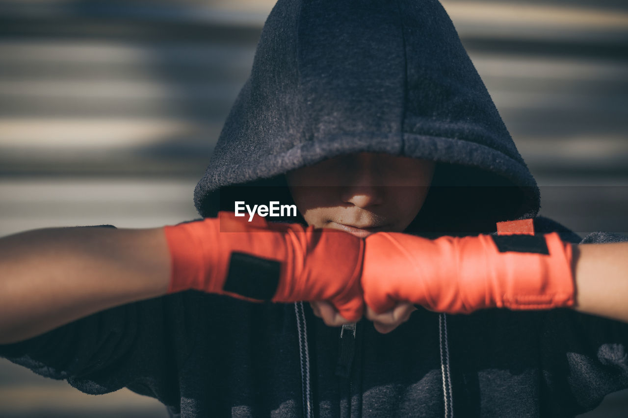 Close-up of boy wearing hooded jacket