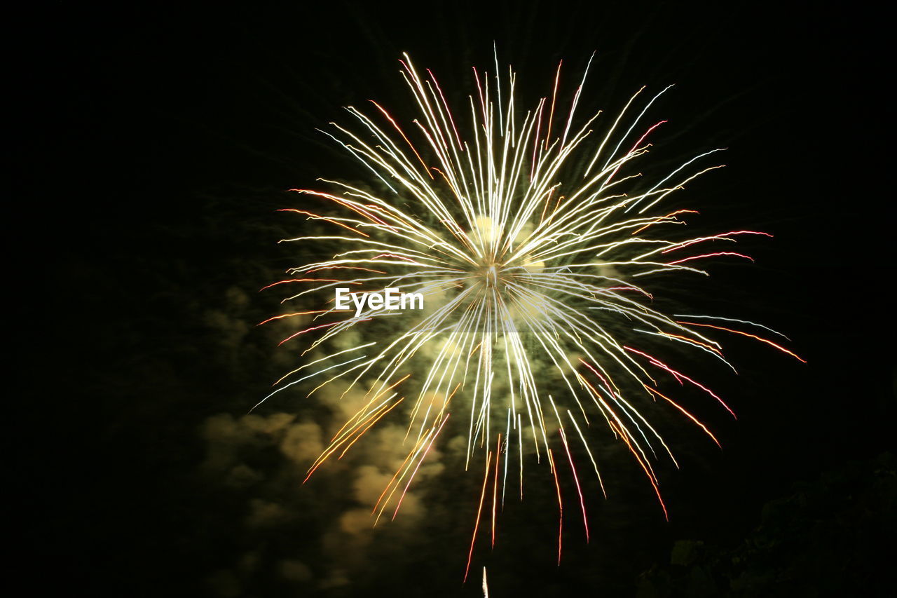 LOW ANGLE VIEW OF FIREWORK DISPLAY