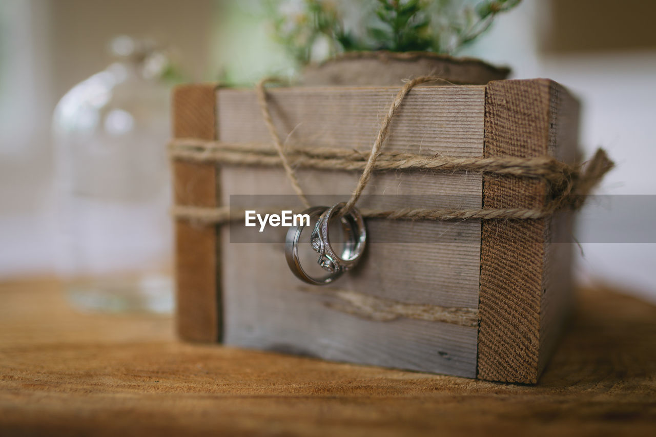 Wedding rings on top of wood round