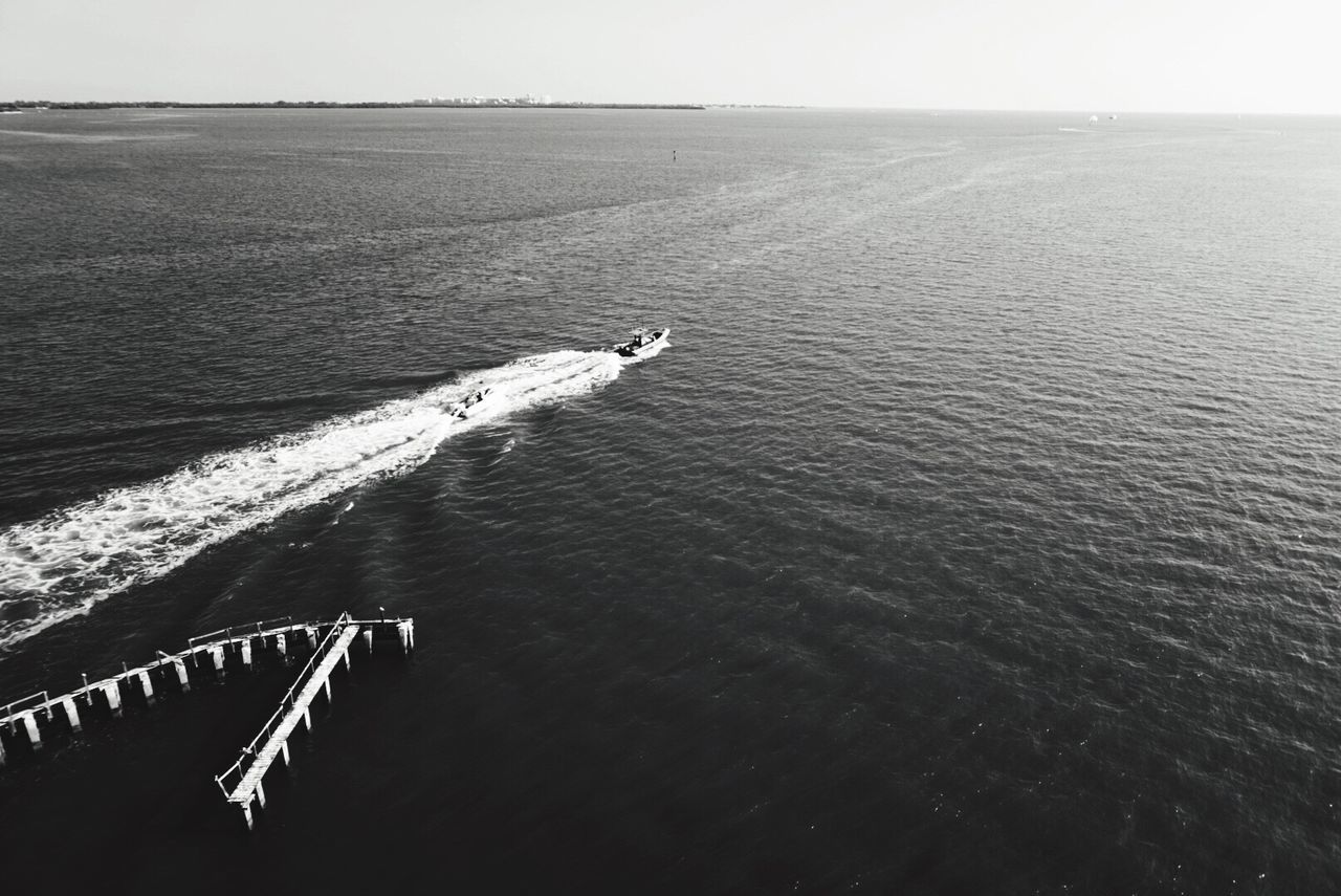 Scenic view of boating sailing through calm sea