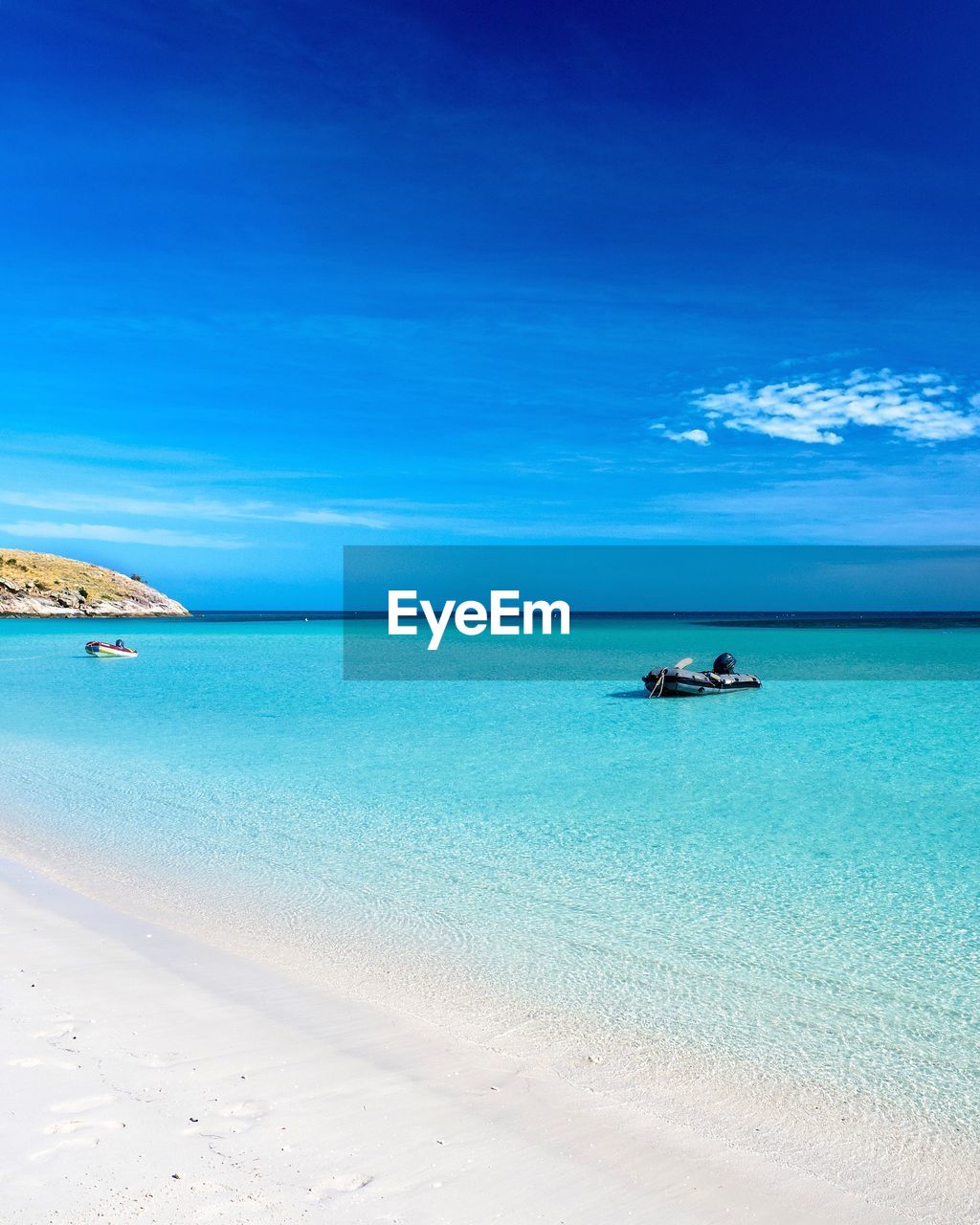 Scenic view of sea against blue sky