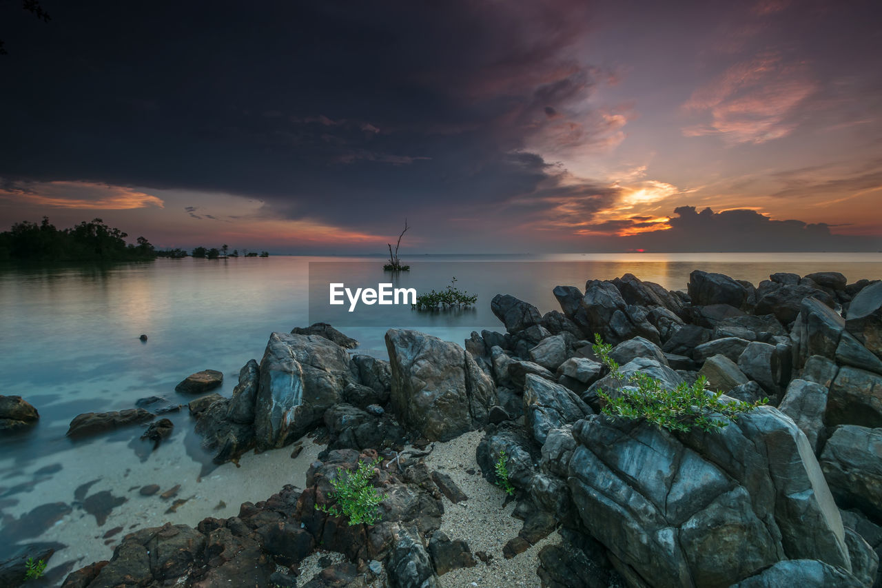 Scenic view of sea against sky at sunset