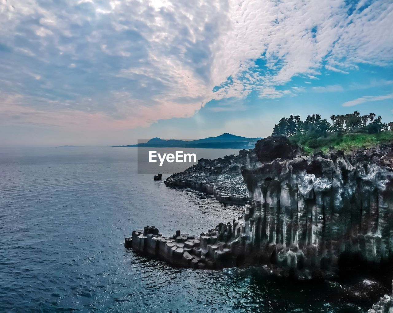 PANORAMIC VIEW OF SEA AND ROCKS AGAINST SKY