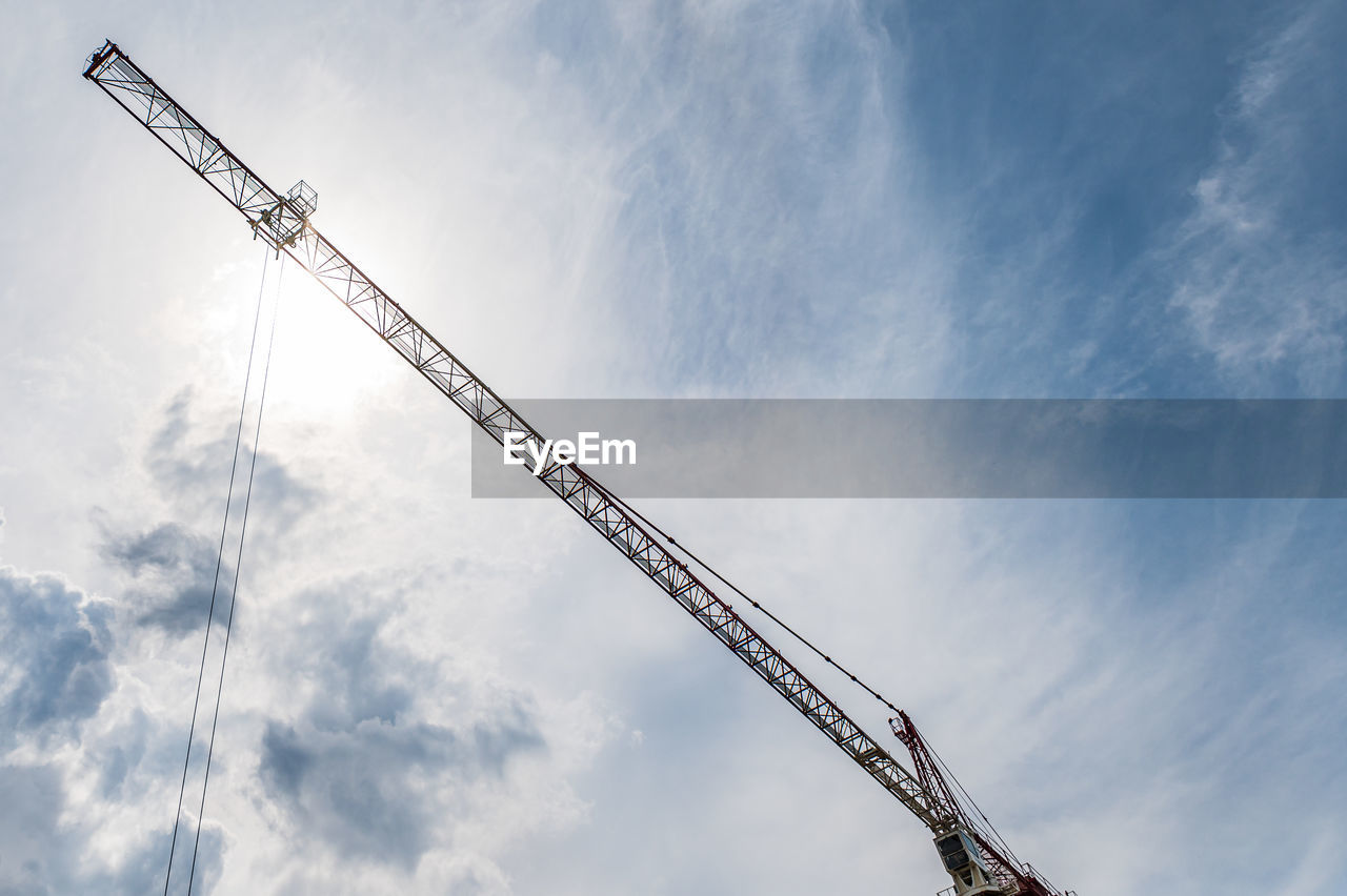 crane - construction machinery, sky, cloud, construction industry, machinery, construction site, industry, architecture, development, construction machinery, low angle view, nature, mast, blue, business, no people, built structure, outdoors, metal, business finance and industry, day, equipment, alloy, steel, overhead power line, copy space, line